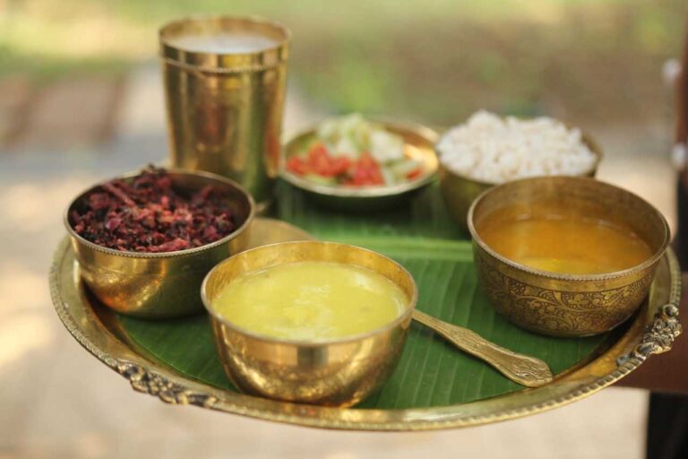 Traditional Kerala Ayurvedic meal served on banana leaf with rice and curries