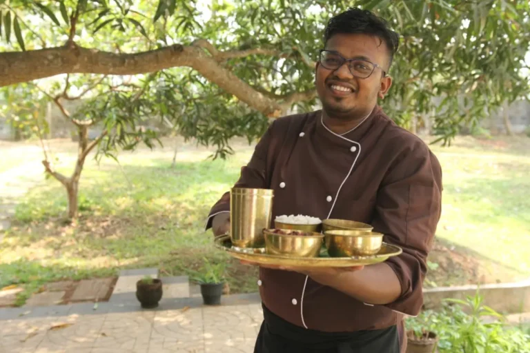 Ayurvedic Indian Thali utensils in hand with a smile