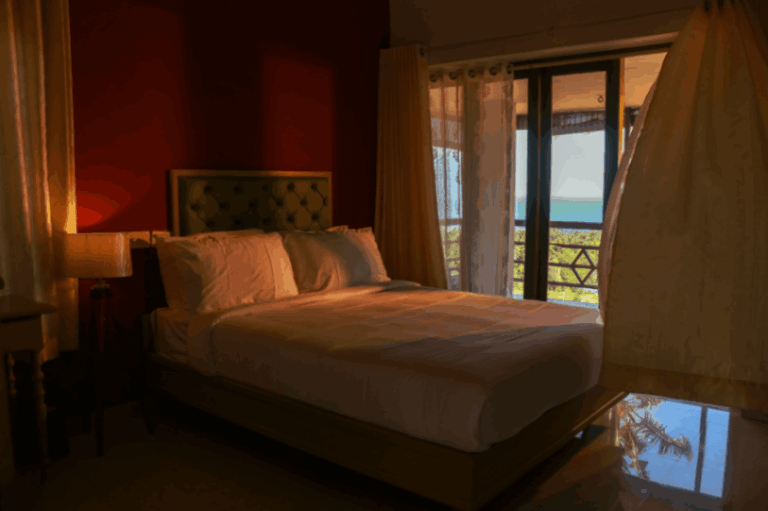 Bedroom with Beach view and coconut trees at Aanandakosha Ayurvedic Resort kerela